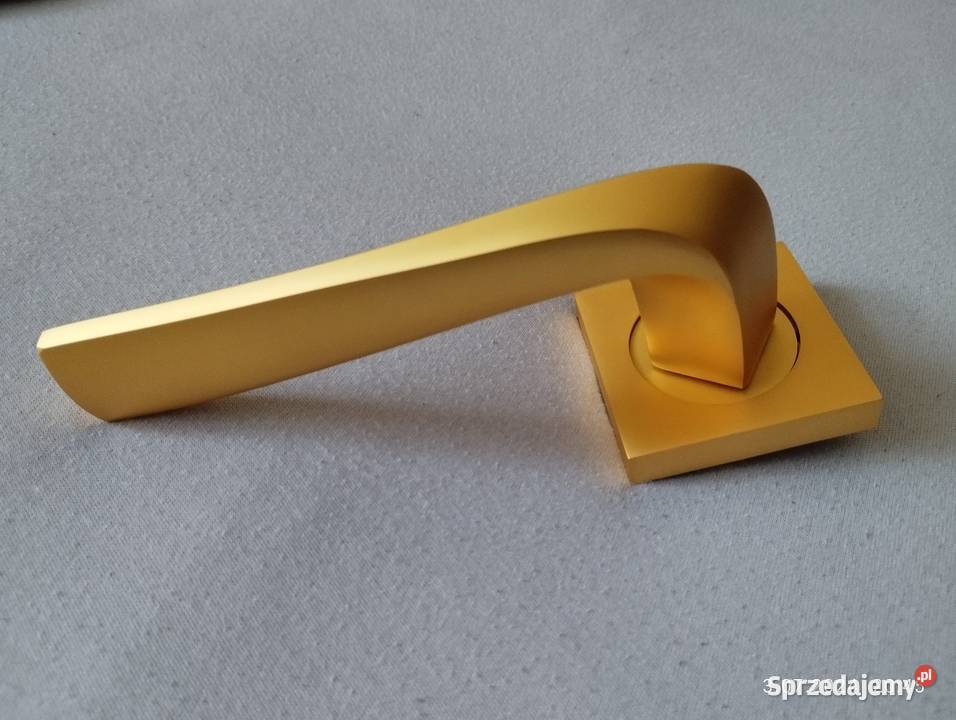 Klamka Adel na rozecie złoty mat Domino Szyld Olsztynek