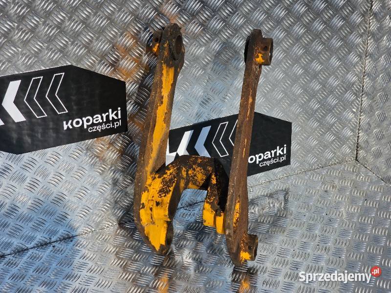 Łącznik ramienia tylniego w koparkoładowarkach
