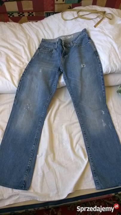 Męskie jeansy jasne z przetarciami Marki