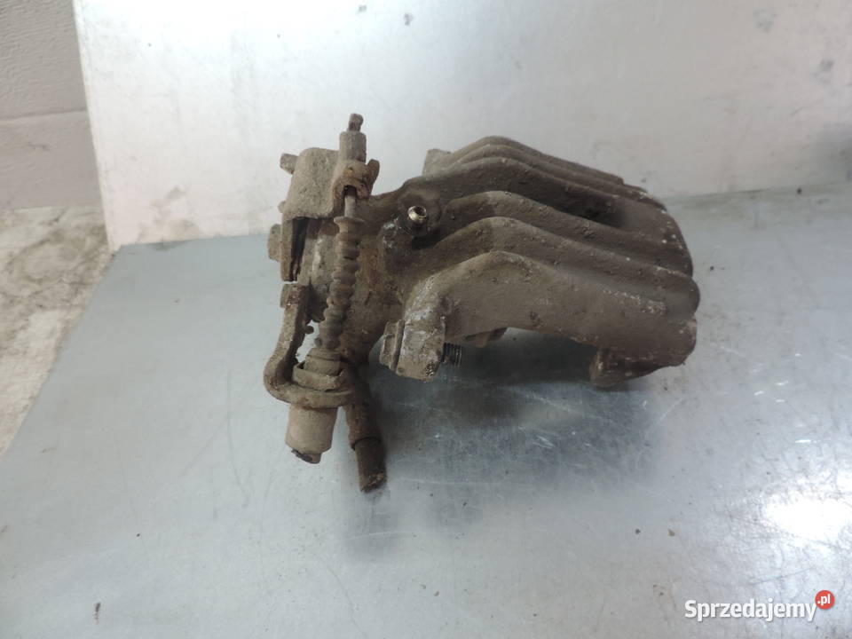 VW PASSAT B5 ZACISK HAMULCOWY LEWY TYŁ