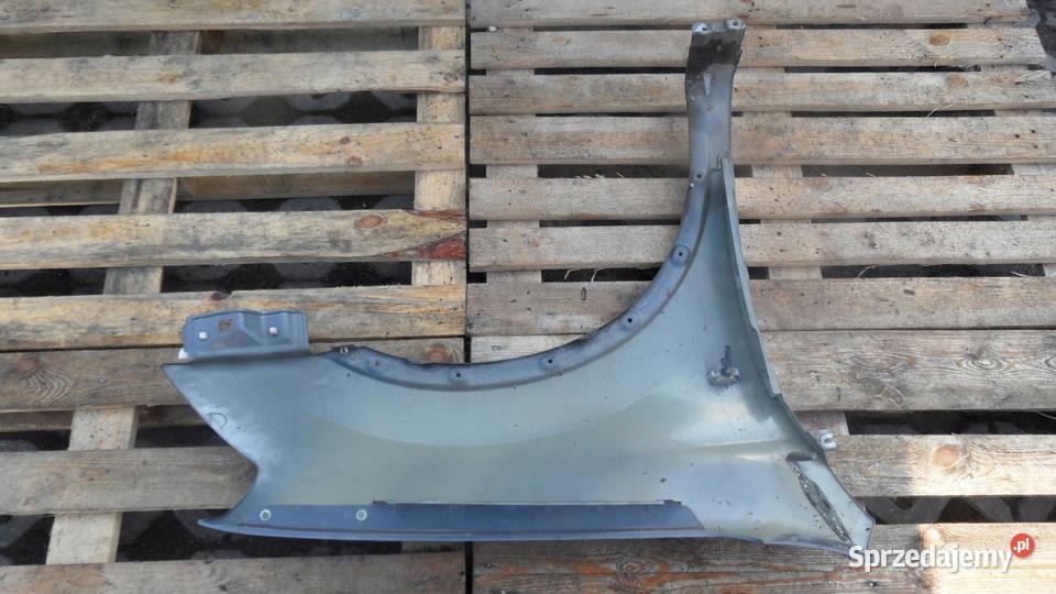NISSAN QASHQAI I 09r błotnik lewy przód