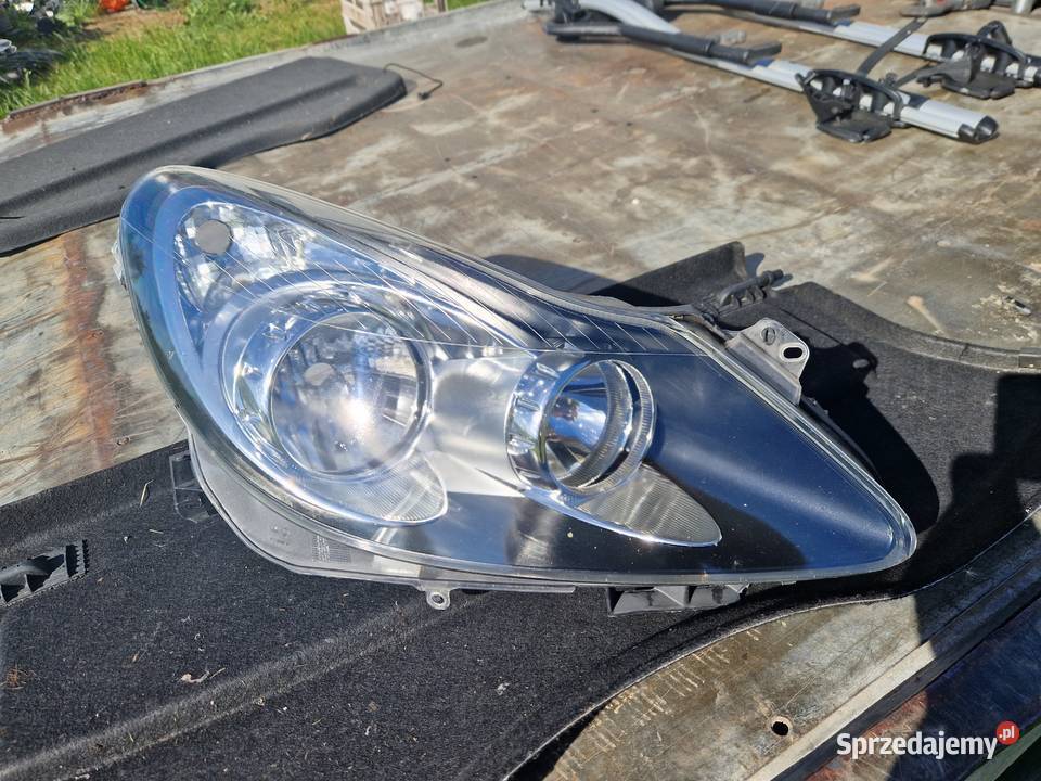 Opel Corsa D reflektor ORG EU osobowe Mielec sprzedam