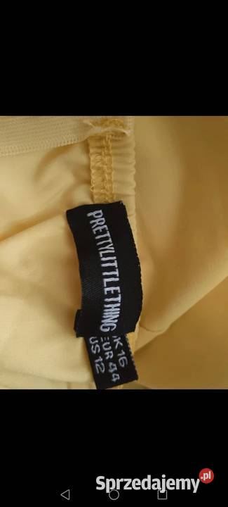 Piękna Sukienka z baskinką wyeksponowane plecy Krosno