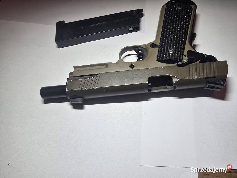 Pistolet 6mm Cybergun Colt 1911 A1 CO2 Rozogi