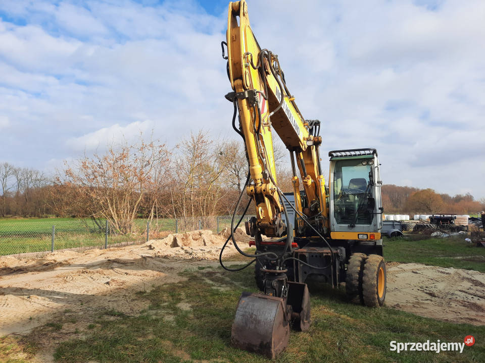 Koparka kołowa HOLLAND WE150C 4x4 2012 r 153 t Baliki