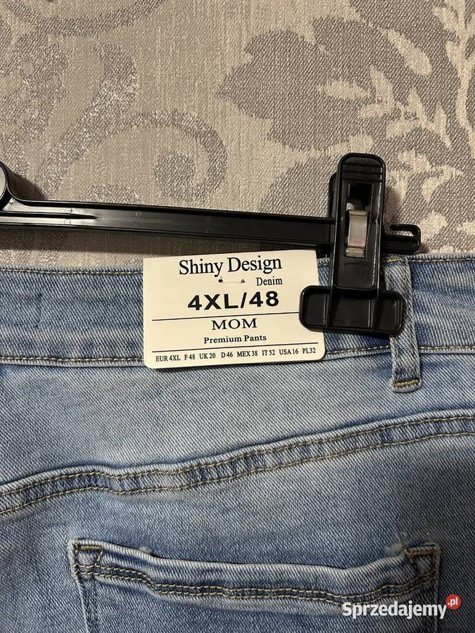 Jasnoniebieskie dżinsy Mom Fit 48