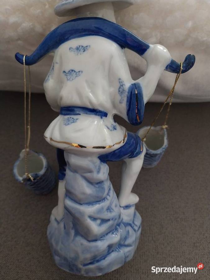 Porcelanowa figurka azjatyckiego rybaka