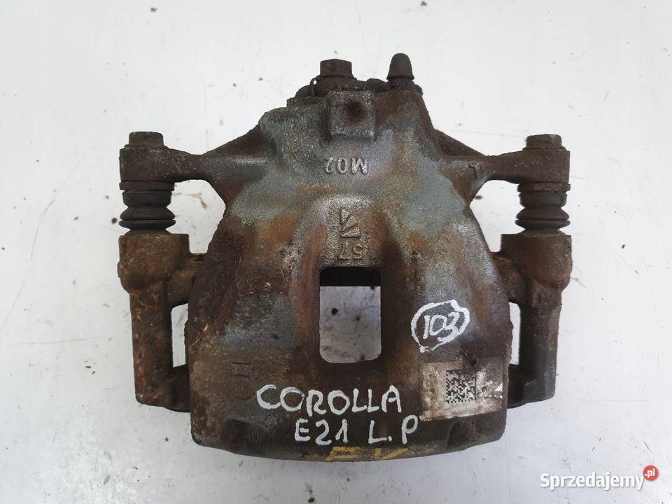 Toyota Corolla XII E21 PRAWY PRZEDNI ZACISK Rudka