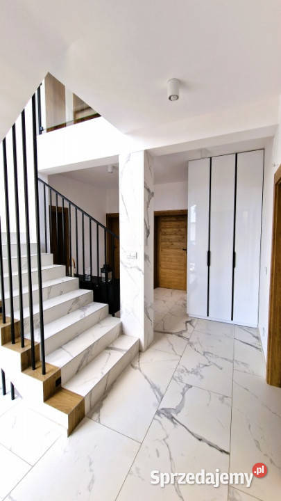 Modernistyczny dom jeziorem z funkcją pensjonatu