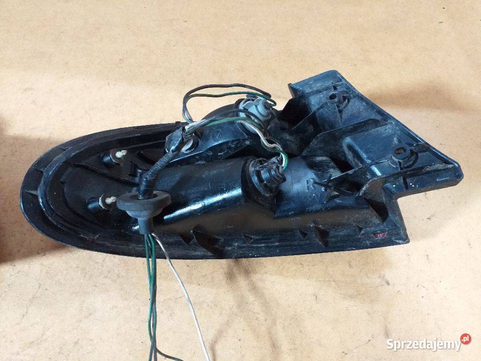 149G MAZDA 323 Lampa tylna lewa prawa Oryginał