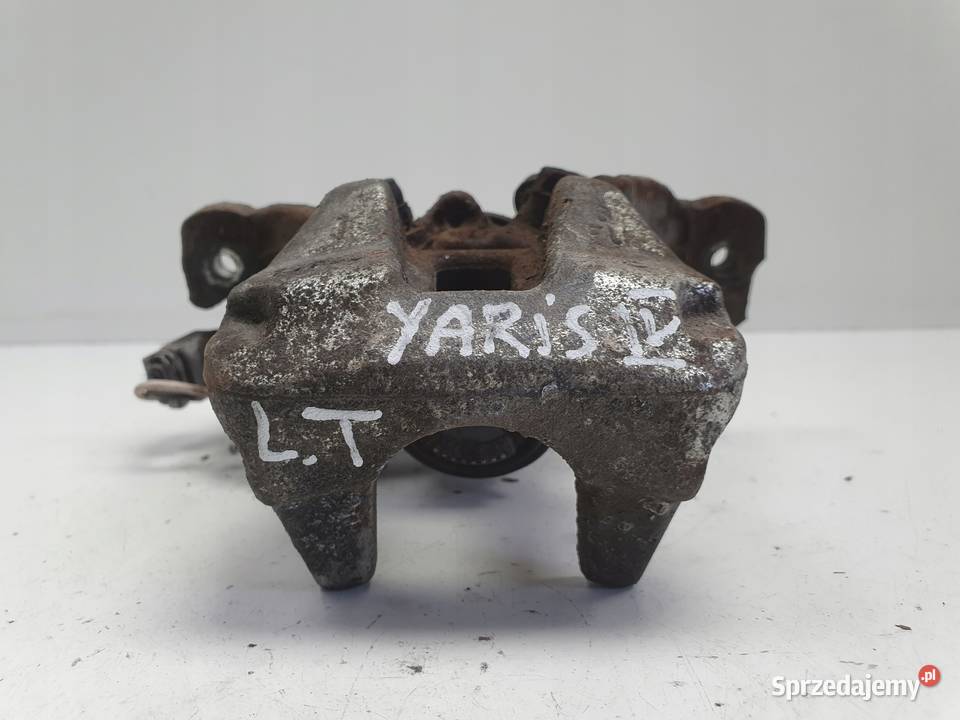 Toyota Yaris IV TYLNY ZACISK HAMULCOWY lewy tył