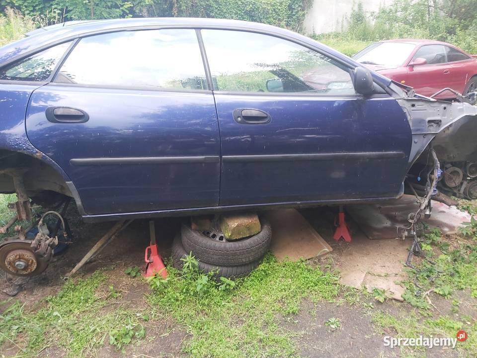 Mazda 323F drzwi komplet boczki siłowniki Wojkowice