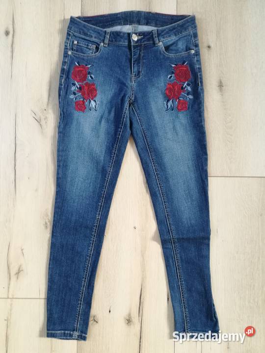 Damskie spodnie jeans z haftami róż nowe Inny wzór Spodnie Dębica