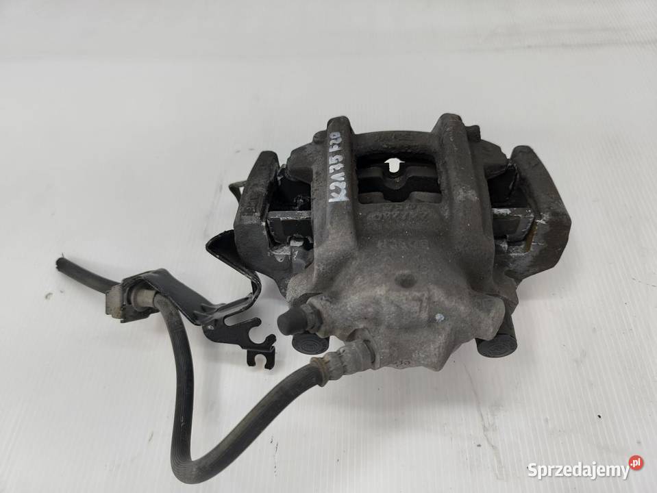 ZACISK LEWY PRZÓD BMW F20 F21 116i wielkopolskie