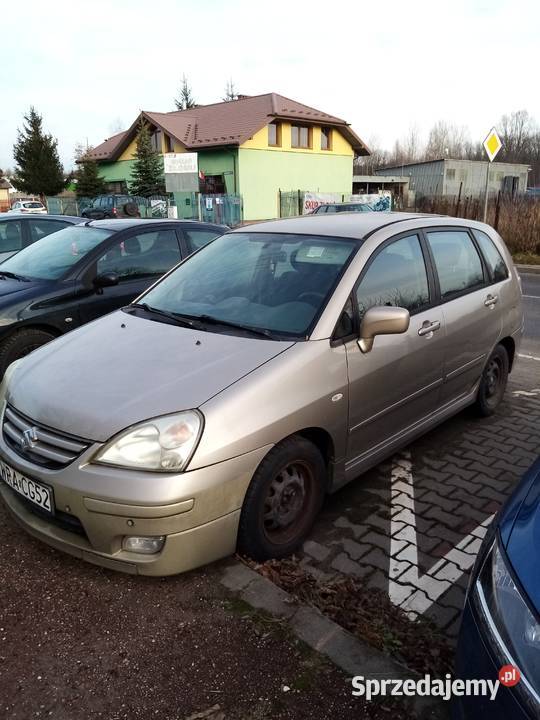 Suzuki Liana chatchback beżowy metal 16 Benzyna 106KM Pionki