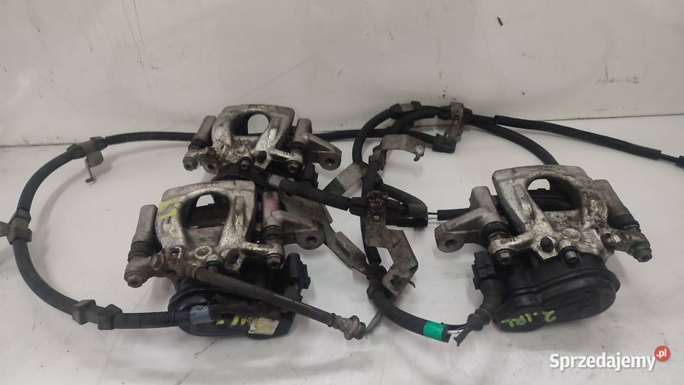ZACISK TYŁ PRAWY LEWY ELEKTRYCZNY NISSAN QASHQAI Włoszczowa