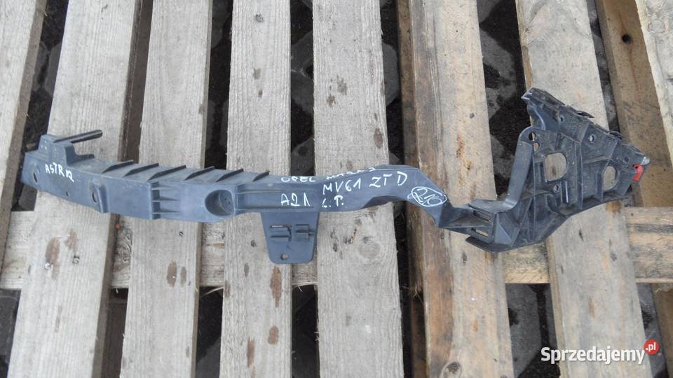 OPEL ASTRA J IV 11r ślizg mocowanie lampy lewy