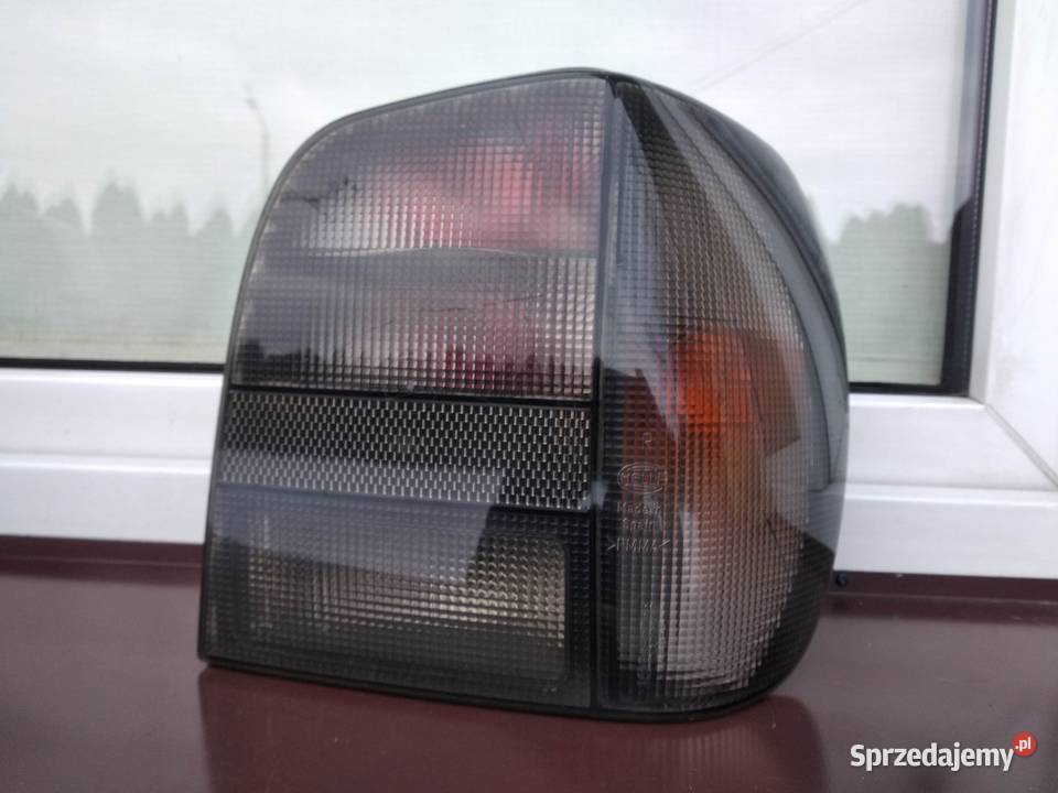 VW Polo III 6N lampy tył tylne Hella Black prawa Motoryzacja Sieradz