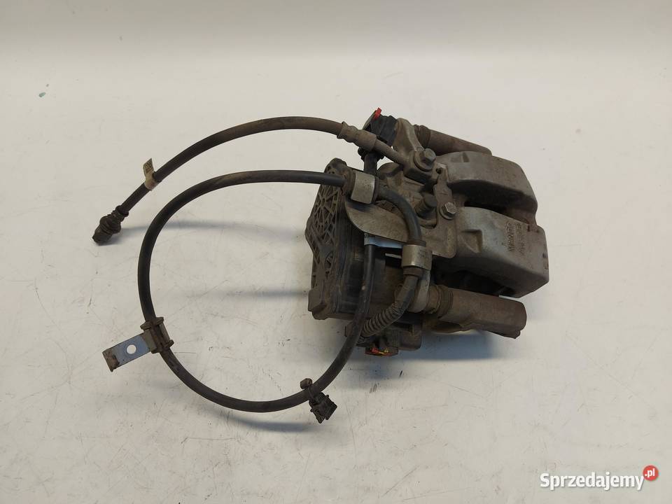 TESLA MODEL Y 2024r ZACISK HAMULCOWY LEWY TYŁ