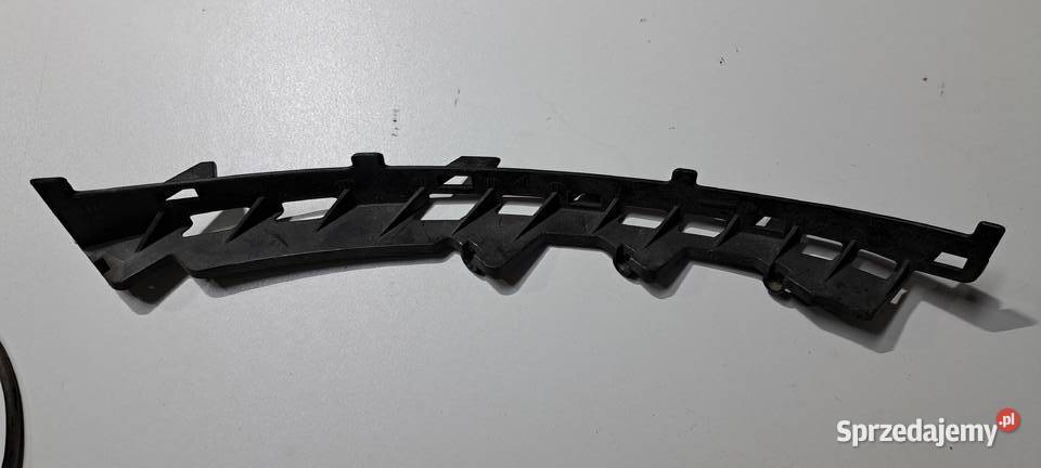 Ślizg mocowania reflektora lewy 1305553007 VW Luzino