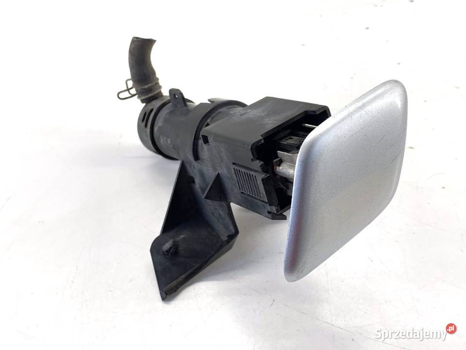SPRYSKIWACZ REFLEKTORA LEWY PRZÓD MITSUBISHI osobowe