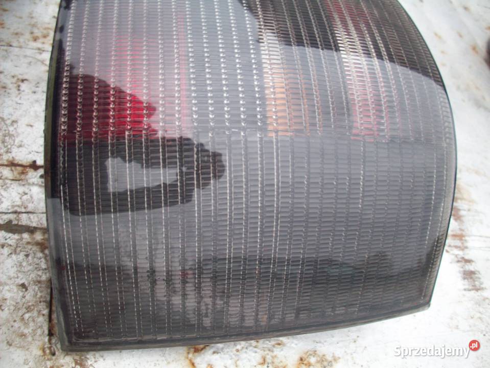 VW PASSAT B5 KOMBI lampy tył ciemne ori osobowe Iława