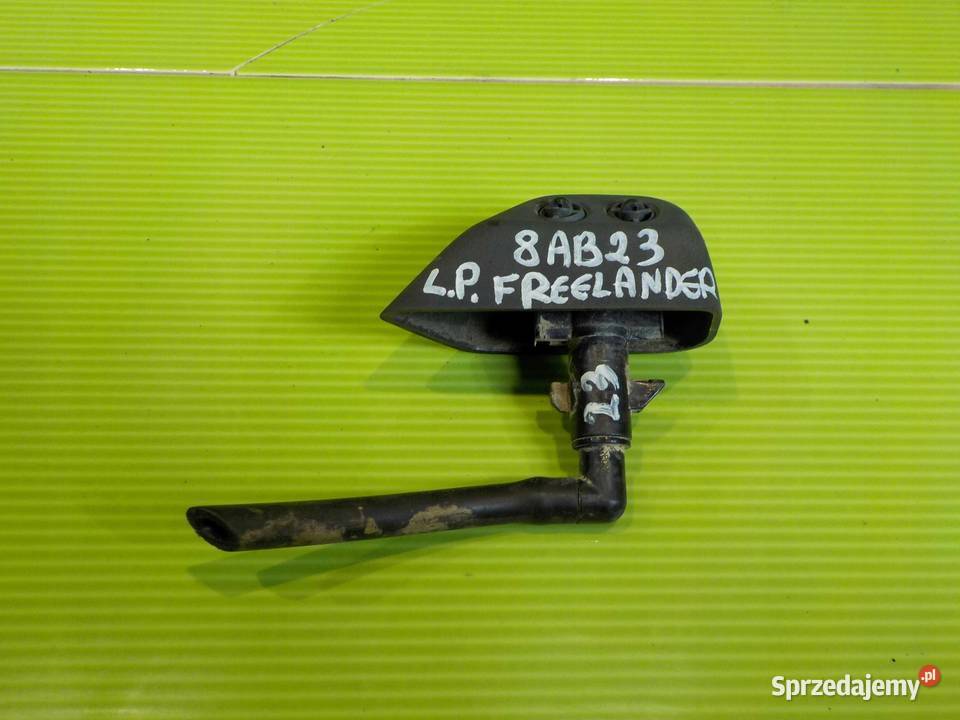 FREELANDER II 07r spryskiwacz lampy lewy przod mazowieckie