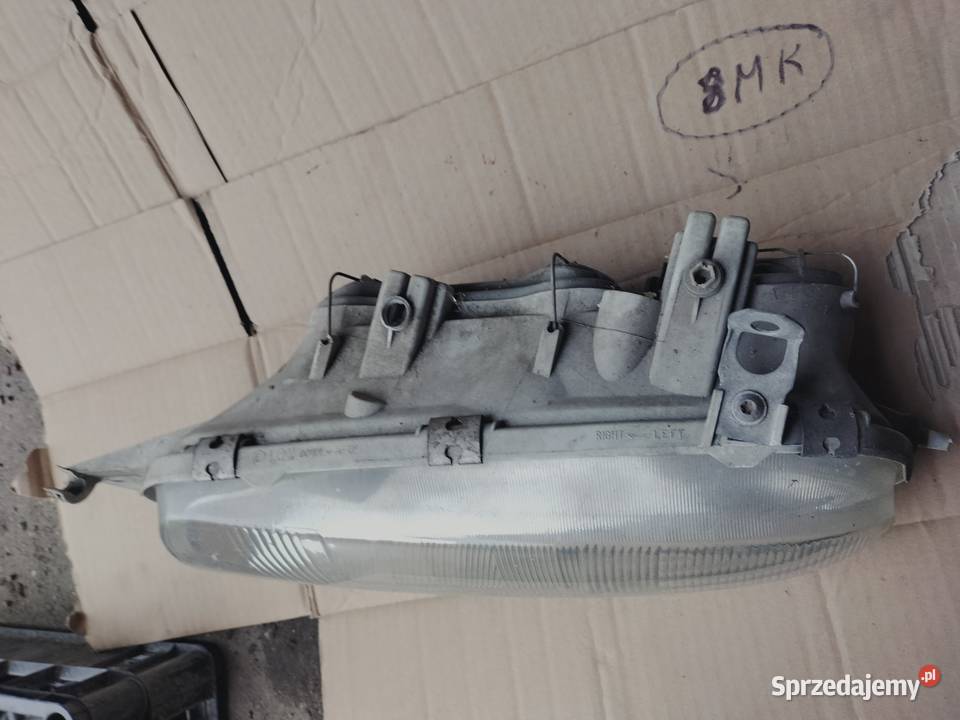 LAMPA PRZÓD PRZEDNIA LEWA REFLEKTOR FORD FIESTA Oświetlenie Kamień-Kolonia
