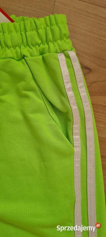 Spodnie dresowe damskie neonowy zielony Cięcina