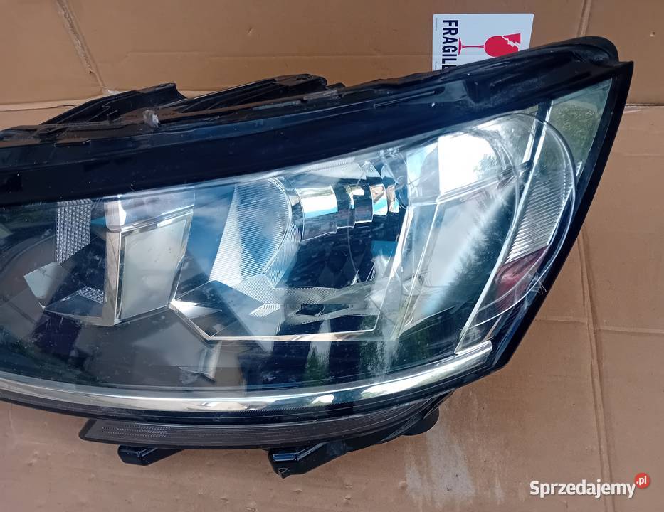 VW T61 reflektor lampa lewy przód osobowe Przeźmierowo