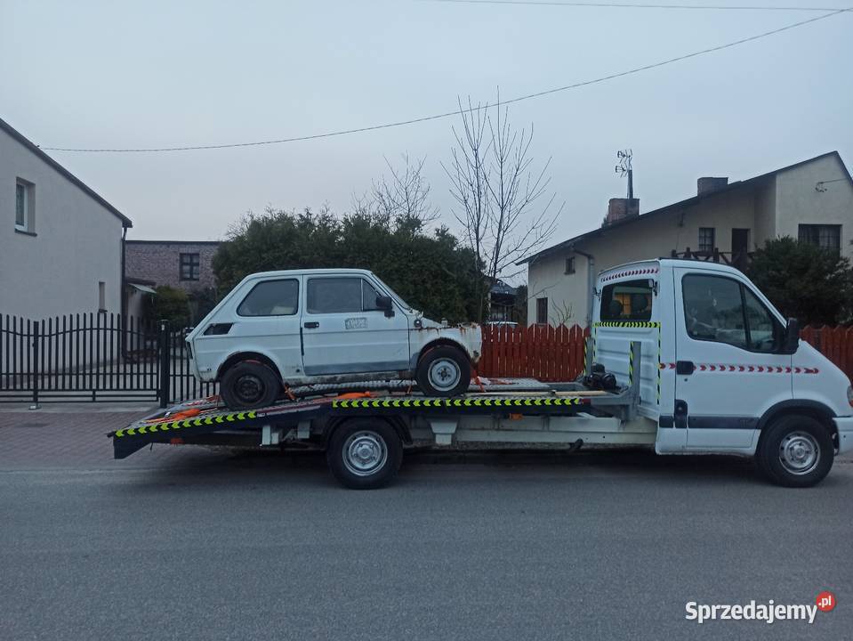 Laweta transport pojazdów maszyn rolniczych Woźniki wynajem pojazdu
