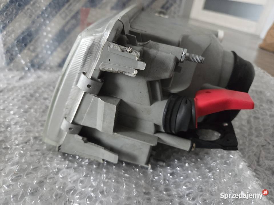 Reflektor lewy Fiat Uno nowy oryginalny Molna