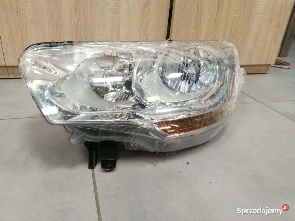 Citroen C4 b7 reflektor lewy przód Kozubszczyzna