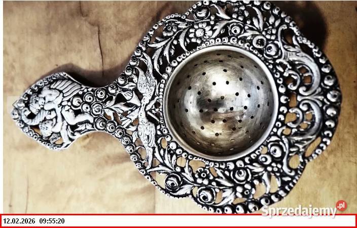 Srebrne sitko do herbaty z motywem puttów1900r Zgorzelec