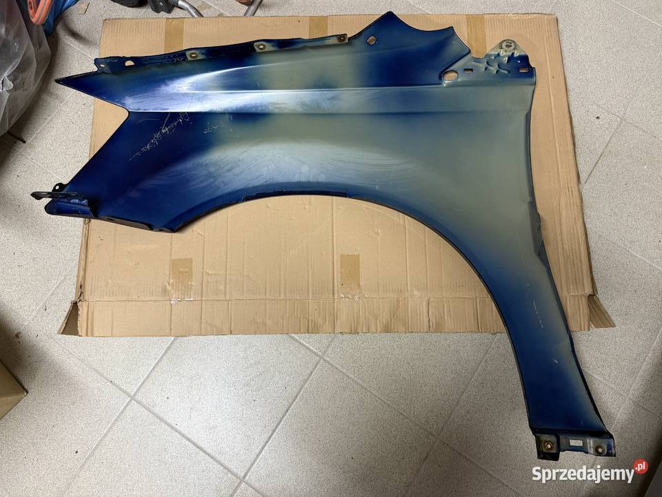 Błotnik prawy przód Dodge Grand Caravan oryginał osobowe