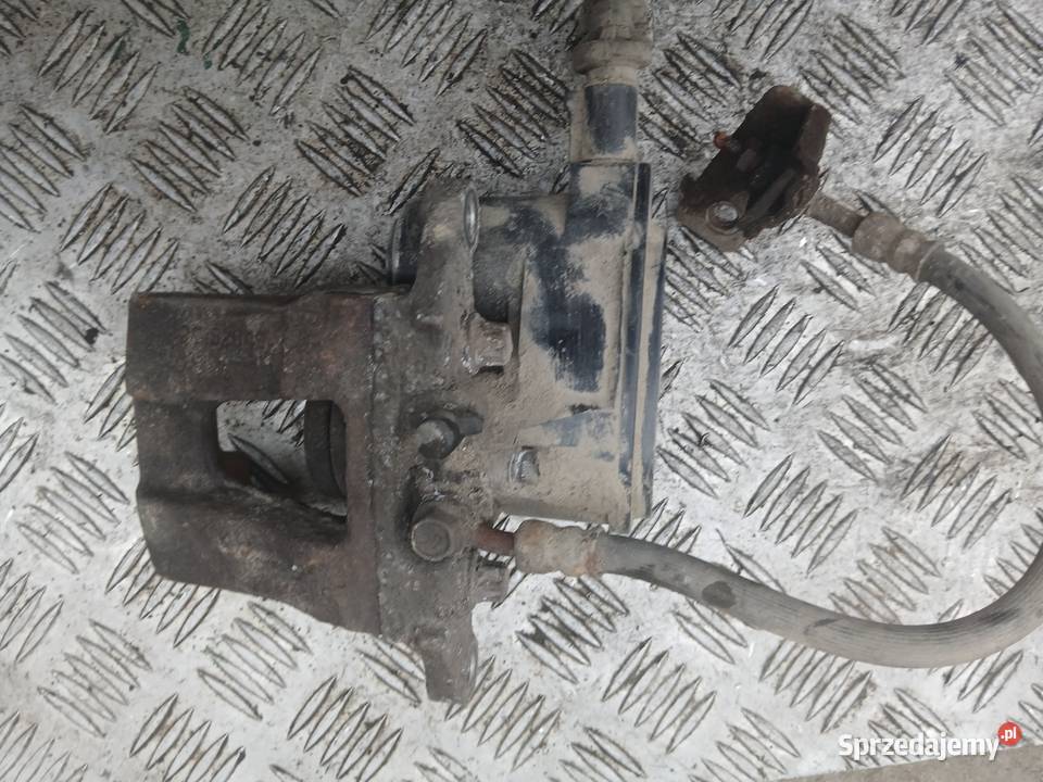 Elektryczny Zacisk hamulcowy lewy tył BC152009 Radłów