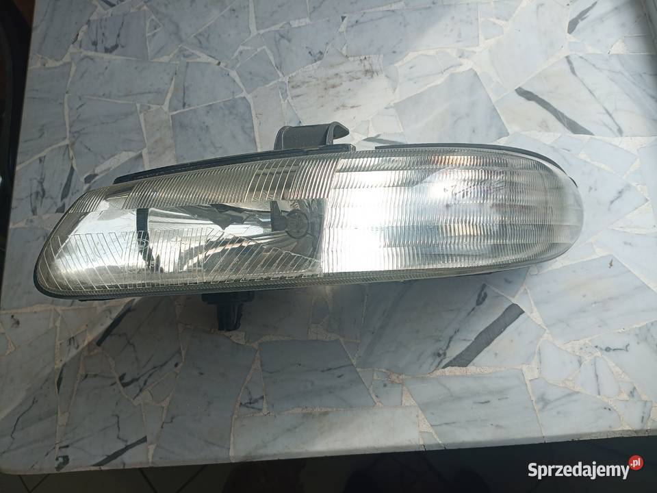 lampa chrysler grand voyager 1997 lewy przód
