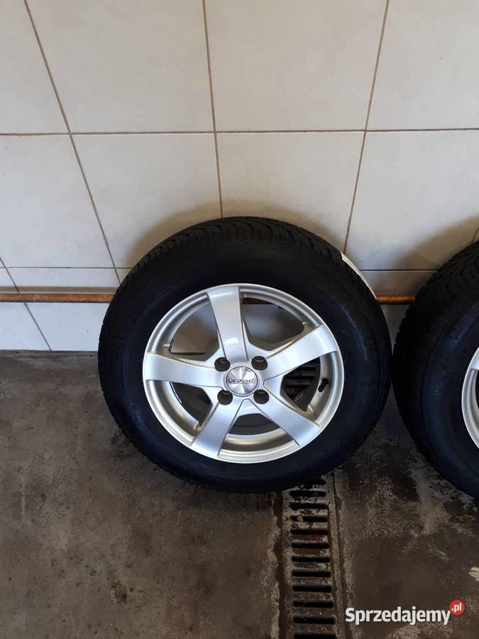Sprzedam felgi aluminiowe z oponami 4x100R14 świętokrzyskie Wilkowa