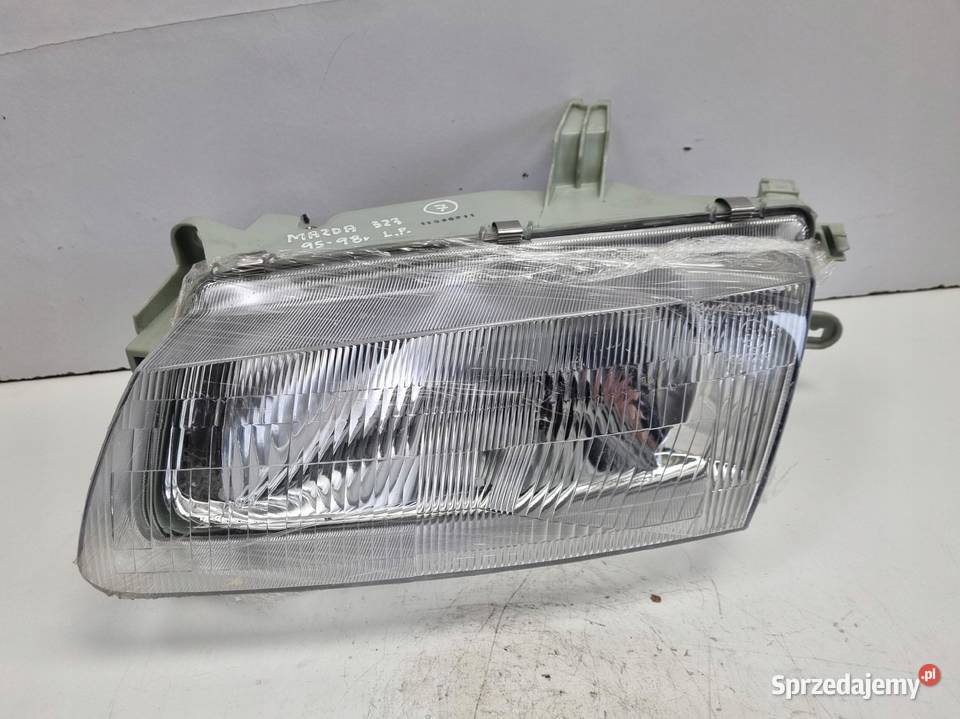 LAMPA LEWA Mazda 323 BA 9598r PRZEDNIA LEWY Rudka