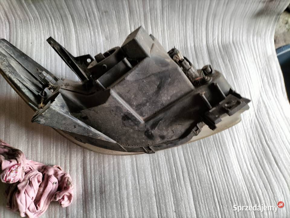 Mazda MPV Reflektor Lampa Lewa Przód P3814L