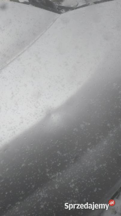 Blotnik przód lewy OPEL MERIVA srebrny