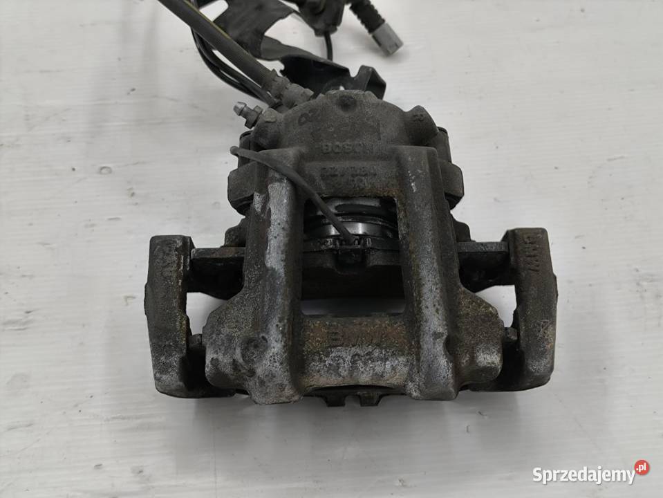 ZACISK LEWY PRZÓD BMW F20 16 116i 136 wielkopolskie