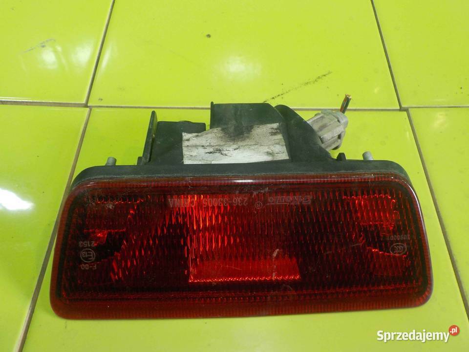 NISSAN JUKE I F15 11r lampa w zderzak tyl Suków