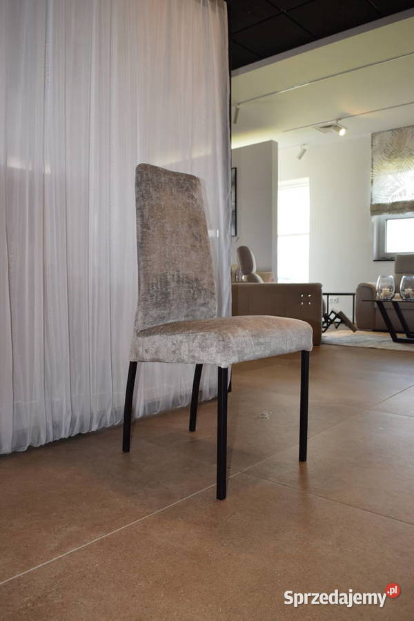 krzesło szare tapicerowane na metalowych nogach
