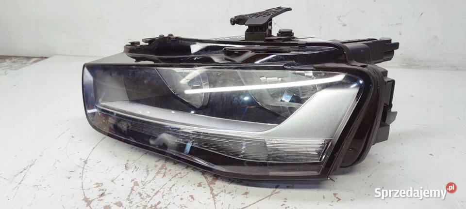 REFLEKTOR LEWY AUDI A4 B8 LIFT UK 8K0941003M osobowe Przystajń