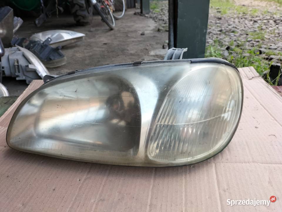 KIA CARNIVAL LAMPA PRZÓD LEWA Kamień-Kolonia