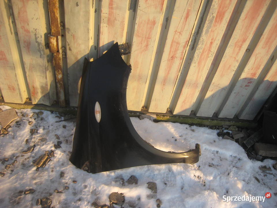 Błotnik przedni prawy Toyota Yaris I 9906 czarny Kraków