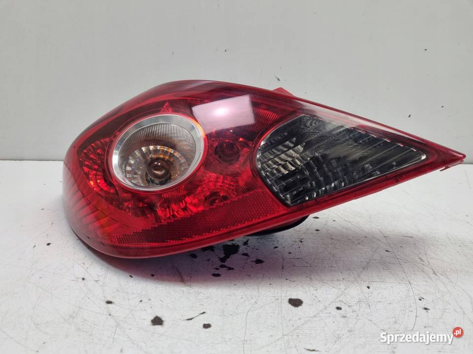 LAMPA TYLNIA LEWA Opel Corsa D 3D HTB 0614r LEWY Rudka