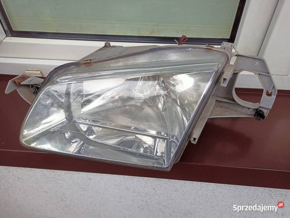 Mazda 323F BJ lampa przednia lewa reflektor Sieradz sprzedam