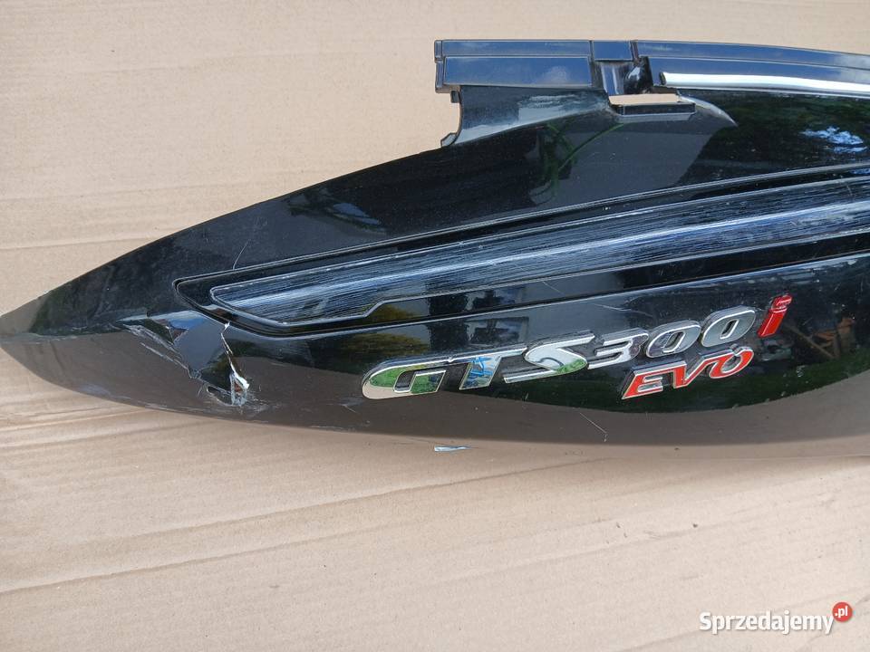 Zadupek emblemat Sym Gts 300i